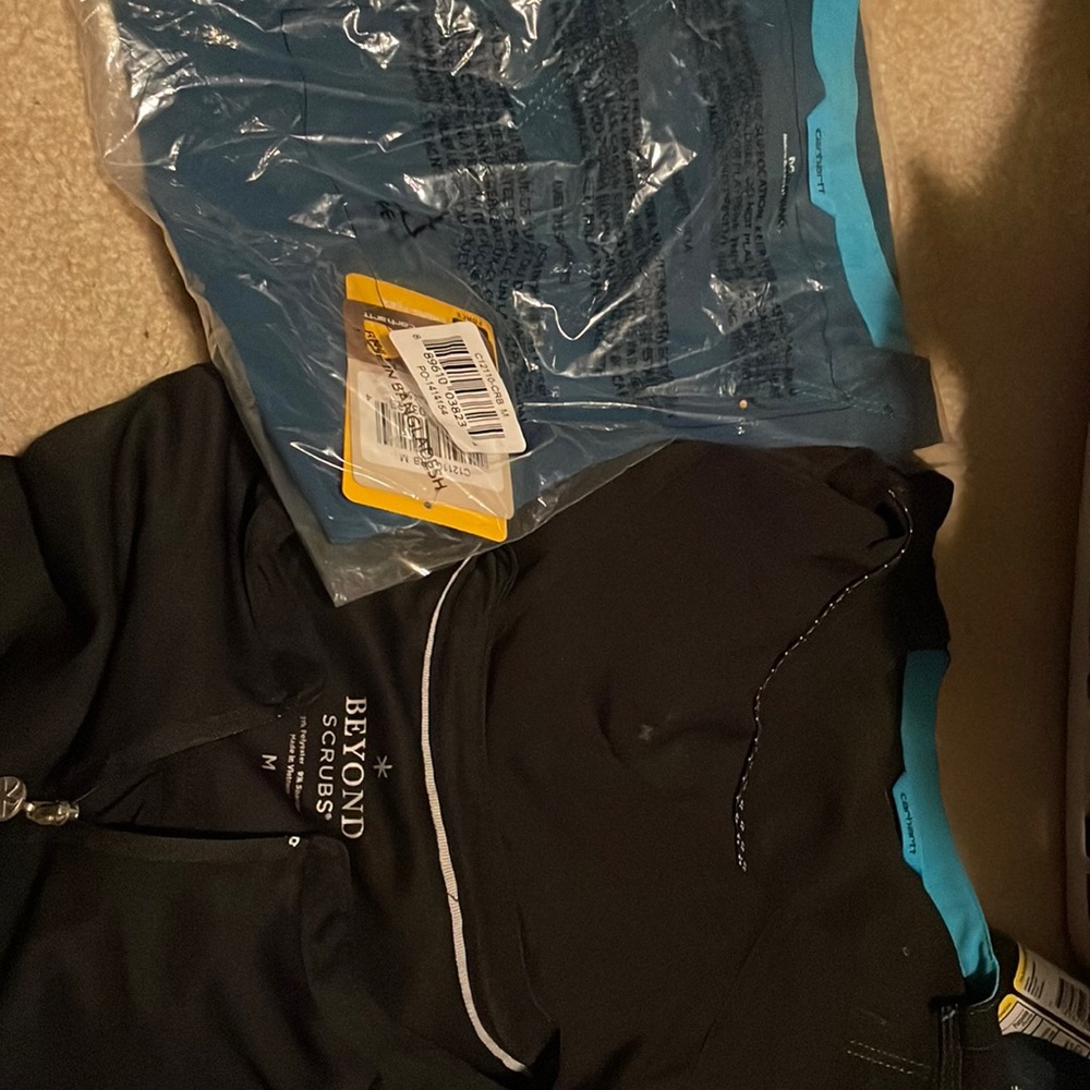 Like new black scrub too. One new blue with tags. Carhartt/beyond soft
